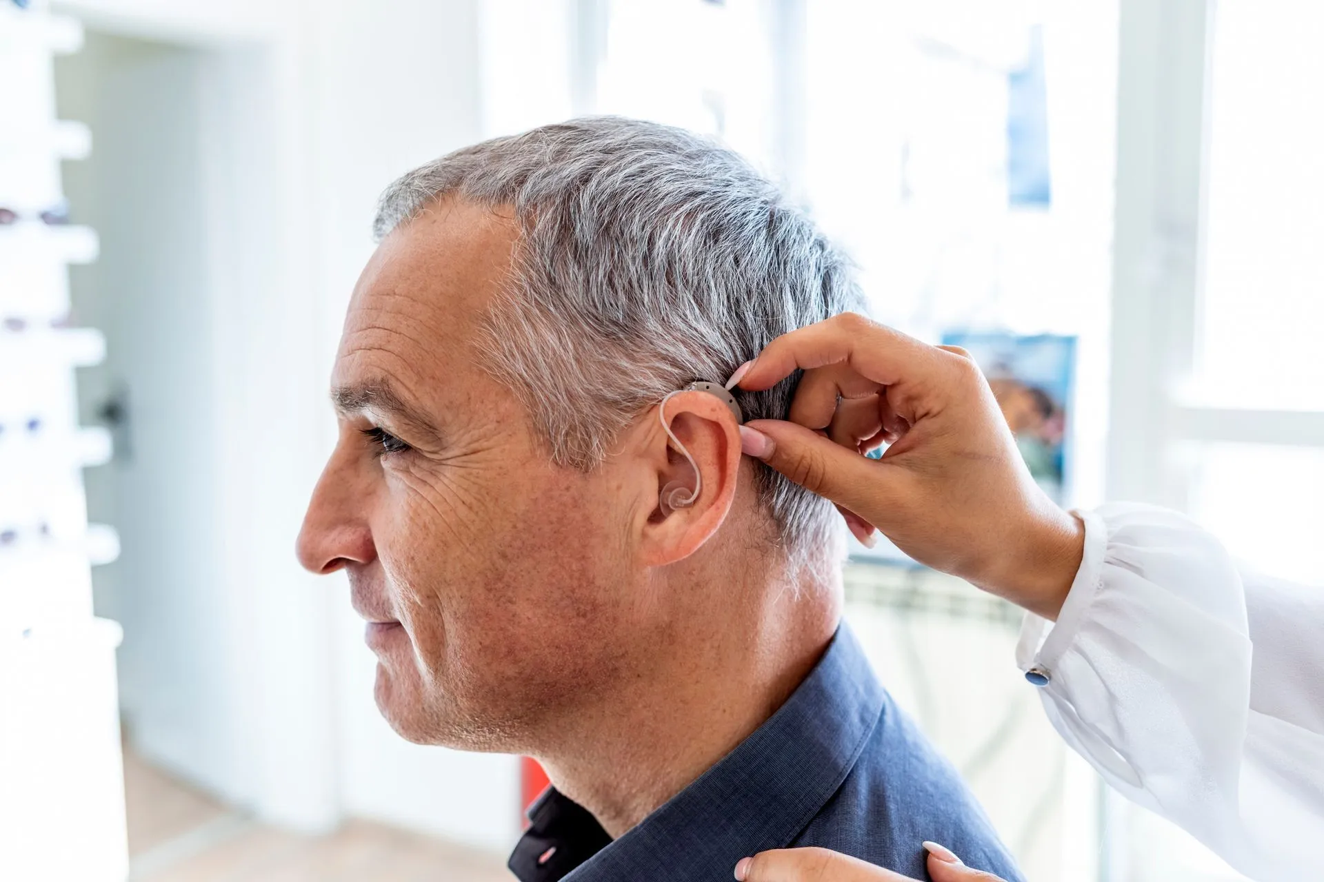 Audiologist providing hearing care to a patient