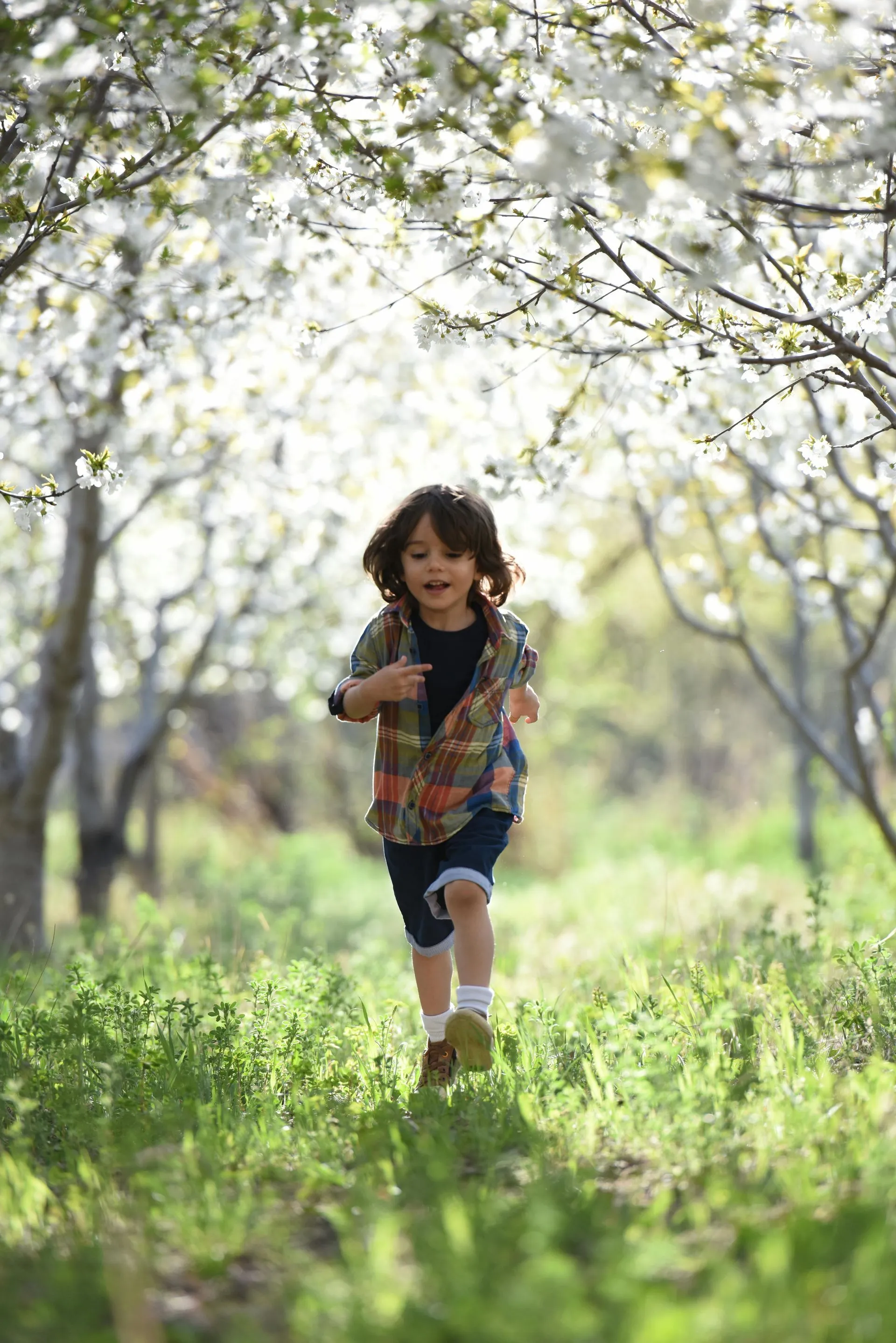 A child smiling outdoors